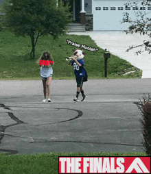 a girl holding a sign that says ' praise moolah '