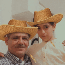 a man and a young boy wearing cowboy hats