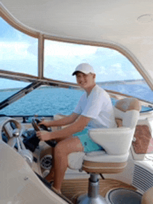 a man is driving a boat in the ocean