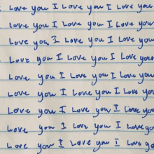 a blue piece of paper with the words " i love you " written on it