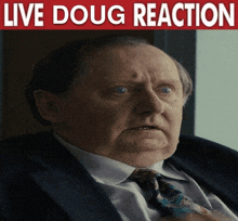 a man in a suit and tie with a live doug reaction sign above him