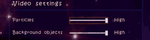 a video settings screen with particles and background objects