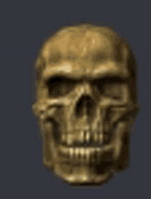 a gold skull with no teeth is on a dark background