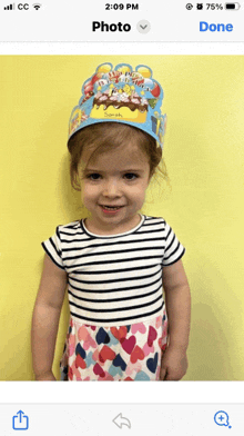 a little girl wearing a birthday crown with the name sarah