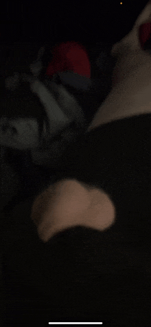 a blurred image of a person 's foot in the dark