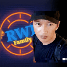 a man stands in front of a logo for rwj family