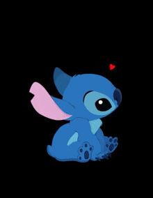 a blue stitch with a pink ear and a red heart on its head