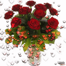 a bouquet of red roses in a vase with hearts surrounding it