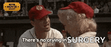 a man and a woman are sitting next to each other on a baseball field and talking .