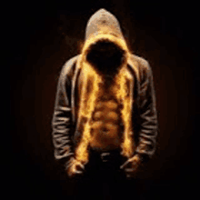 a man in a hooded sweatshirt with fire coming out of his chest .