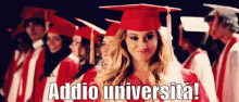 a woman in a graduation cap and gown stands in front of a group of graduates and the words addio universita