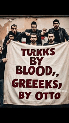 a group of men are holding a banner that says turkks by blood greeeks by otto