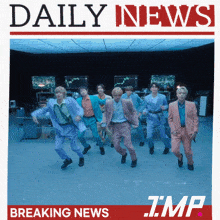 a group of men are dancing in front of a newspaper that says daily news and breaking news