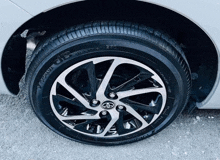 a close up of a yokohama tire on a car wheel