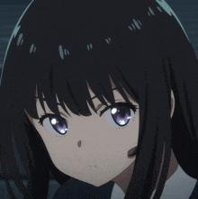 a girl with black hair and purple eyes looks at the camera