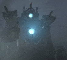 a robot is standing in the fog with a blue light shining on it .