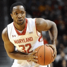 a basketball player from maryland is holding a ball