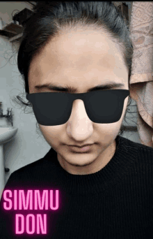 a woman wearing sunglasses and a black sweater with the words simmu don above her