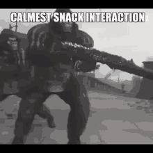 a black and white photo of a man holding a gun with the words `` calmest snack interaction '' written above him .