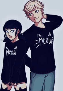 a boy and a girl wearing matching meow sweaters