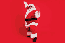 a man dressed as santa claus wearing sunglasses and a hat