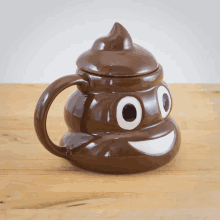 a coffee mug in the shape of a poop