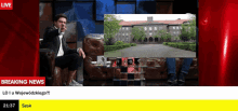 a breaking news screen shows a man sitting on a couch in front of a large building