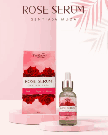 a bottle of rose serum next to a box