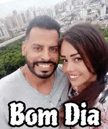 a man and woman are posing for a picture with the words bom dia behind them