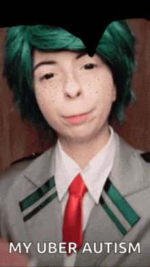 a woman with green hair and freckles is wearing a suit and tie with the words my uber autism below her