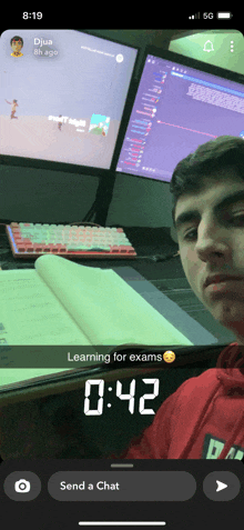 a snapchat of a man sitting in front of a computer with the time of 0.42