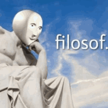 a statue of a man with a mask on his face with the word filosof written below him