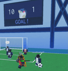 a soccer game is underway with a scoreboard that says goal on it