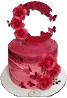 a pink cake with roses and butterflies on top