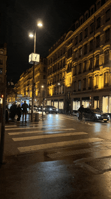 a clock on a pole shows the time as almost midnight