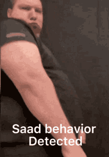 a man 's arm is shown with the words ' saad behavior detected ' below it