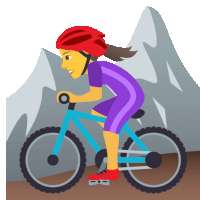 a woman wearing a red helmet is riding a bicycle