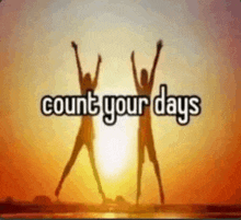 two people are jumping in the air with the words count your days behind them