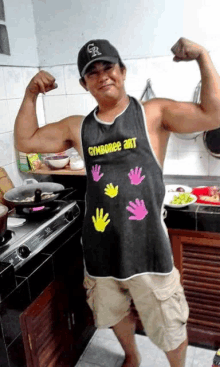 a man in a gymboree apron is flexing his muscles