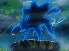 a blue pokemon is standing on a rock