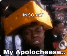 a man with a piece of cheese on his head says i 'm sorry my apolog cheese .