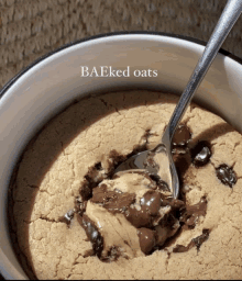 a bowl of baked oats has a spoon in it