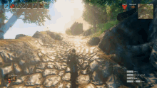 a screenshot of a video game shows a man walking down a rocky path