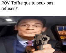 a man in a suit and tie is pointing a gun at the camera with the caption " pov "