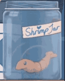 a shrimp jar with a shrimp inside of it on a table .