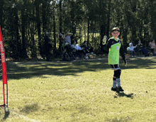 a boy in a green and black jersey with the number 10 on it