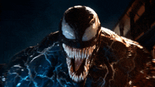 a close up of venom 's face with glowing eyes