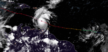 a satellite image of a hurricane with a red line going through it