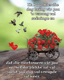 a picture of a wagon filled with red roses and birds flying over it