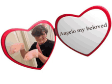 a heart shaped mirror says angelo my beloved on it